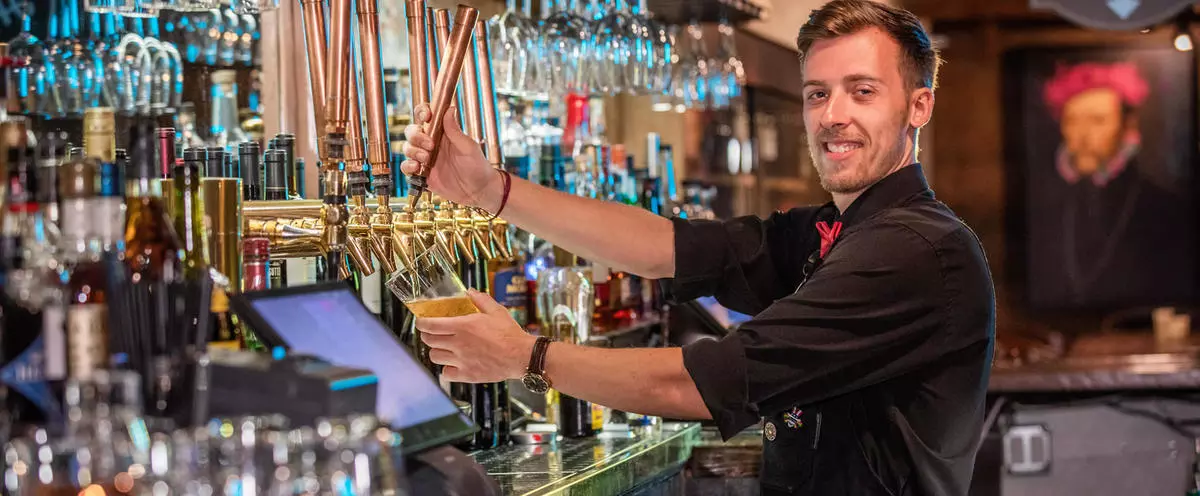 Bartender pouring a beer